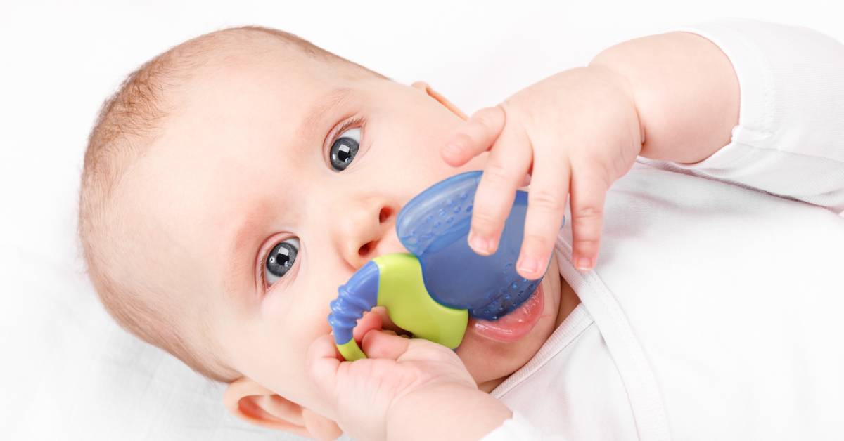 Close-up-of-a-babys-arm-with-a-white-garment-on-a-white-background