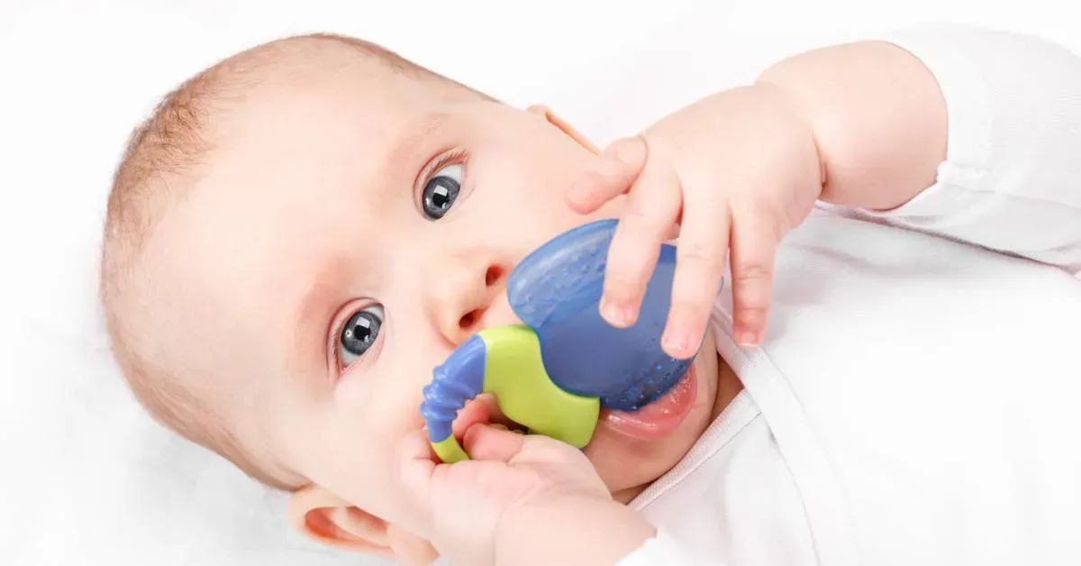 Close-up-of-a-babys-arm-with-a-white-garment-on-a-white-background