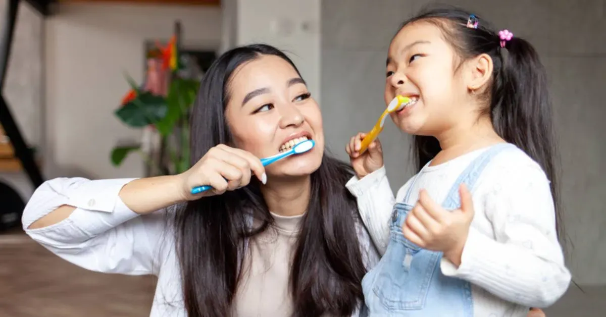 Two-individuals-in-a-room-one-in-a-white-blouse-the-other-in-a-denim-jumper
